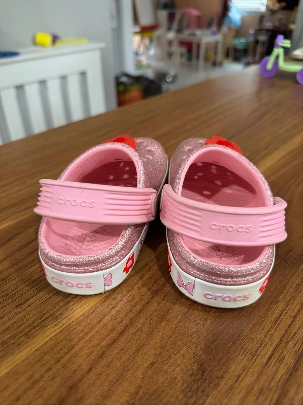 CROCS Kids Pink Glitter Clogs with Red Flower Charms